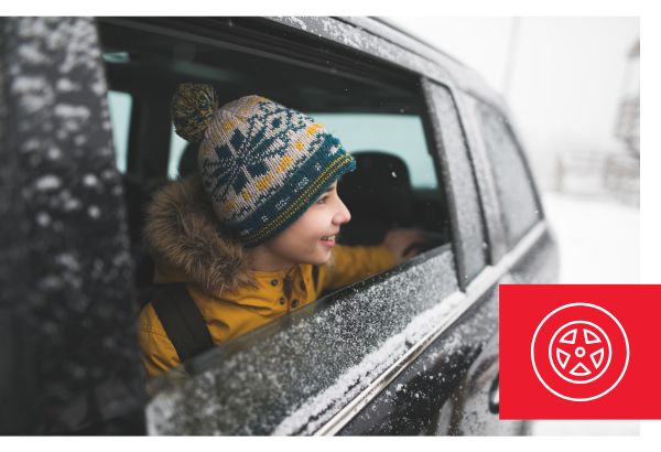 Boy in car looking at snow