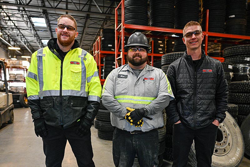 Photo of three Commercial Tire employees